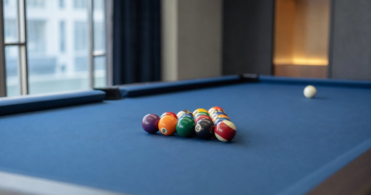 What cloth and cushion choices influence play quality on a luxury billiard table?