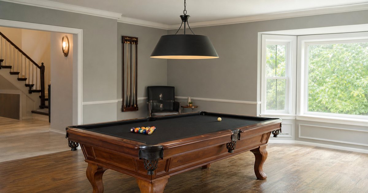 Why does room size dictate the ideal billiard table dimensions for comfortable play?